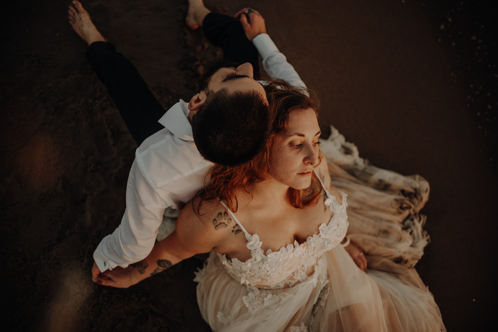 Romantic post-wedding sunset session in Rome for Martina and Edoardo. Enjoying the warm waves of the sea while repromising each other forever love.